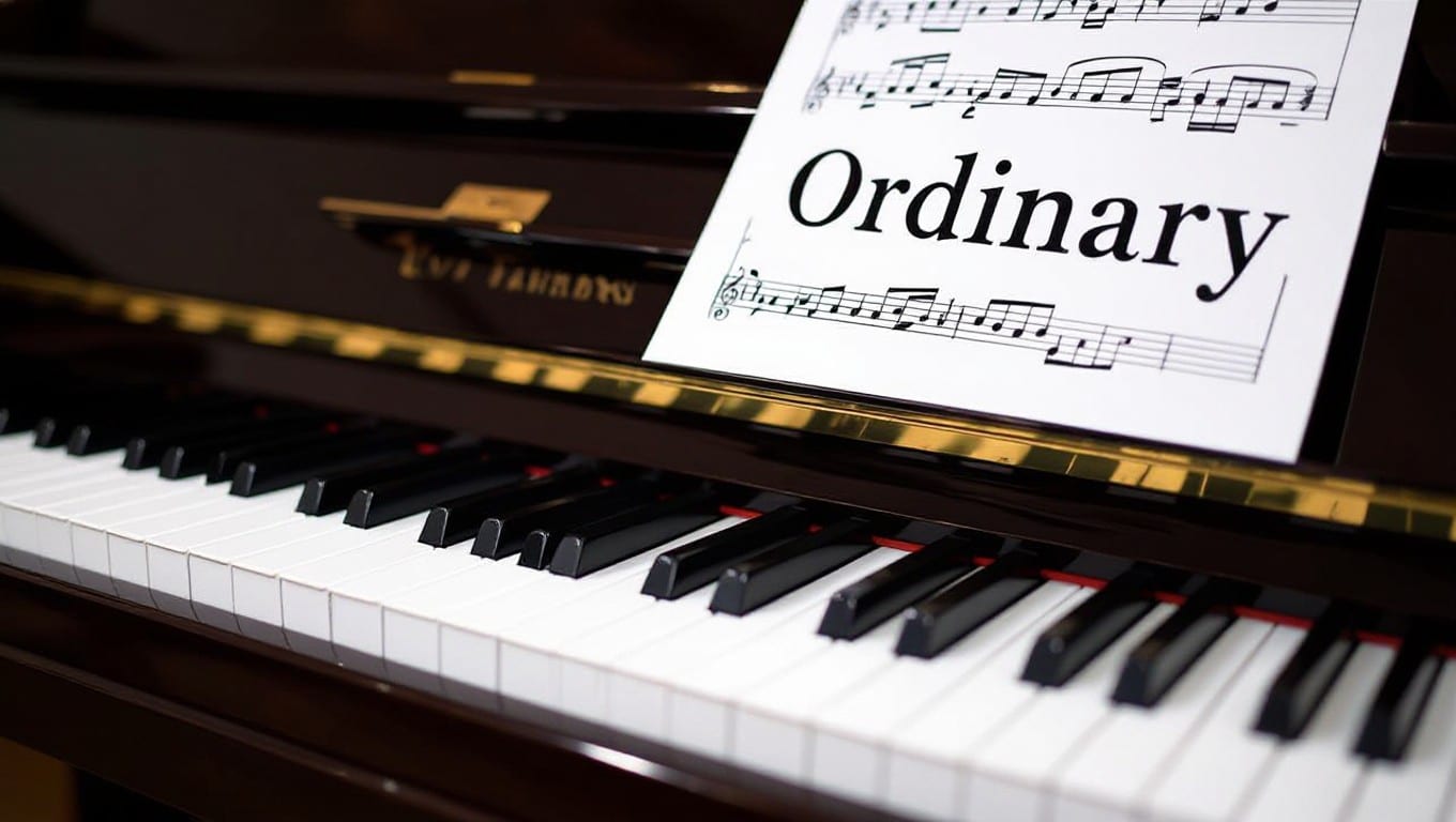 Piano with sheet music “Ordinary” by Alex Warren in close-up